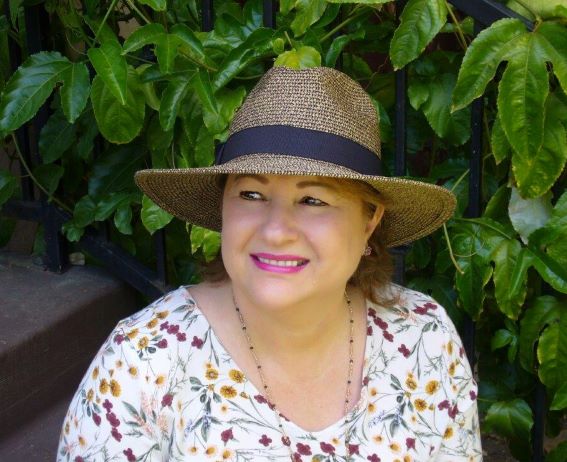 A woman wearing a hat.